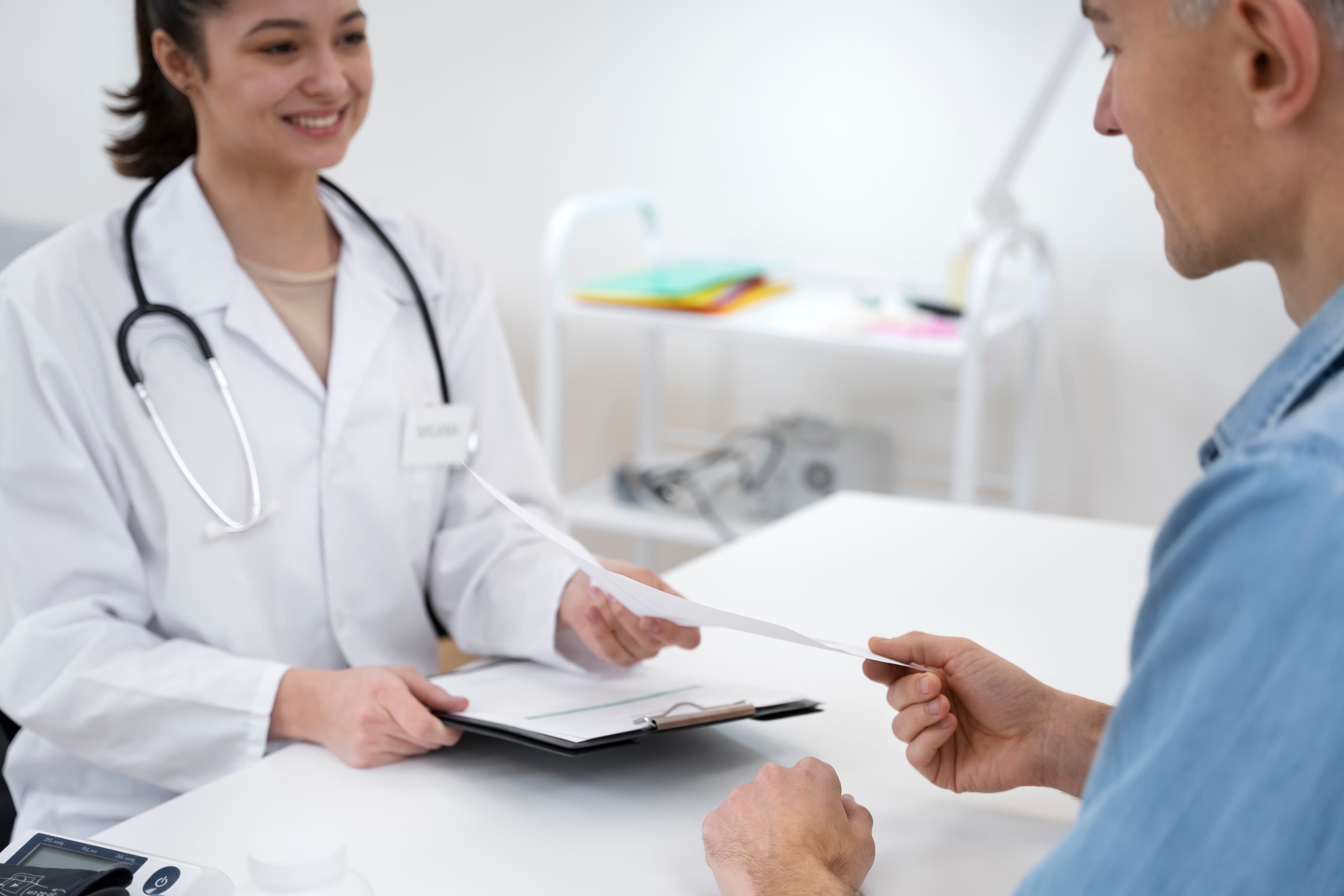 Clinician discussing test results during an STI checkup.